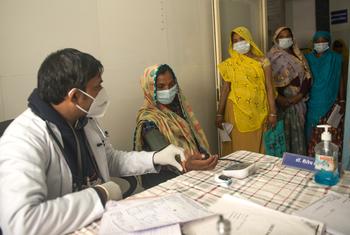 A doctor examines a patient at a health centre in rural India. Rising antimicrobial resistance is making infections harder to treat worldwide.