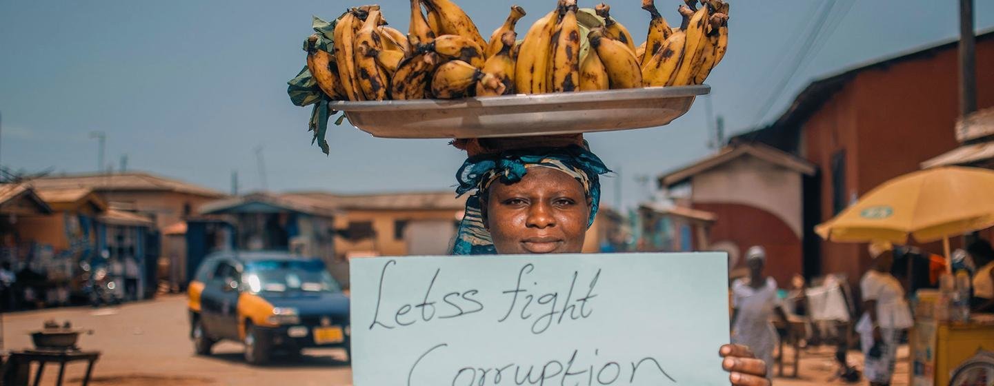 A female fruit vendor demonstrates against corruption in Ghana.