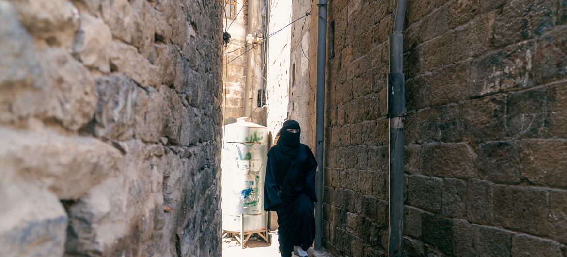 Harbiya al-Hamiry, a Yemeni heritage engineer walking around Old Sana'a.