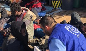 UN migration agency IOM aid workers offer help to migrants who have been returned to shore in Libya after attempting to cross the sea to Europe. (file)