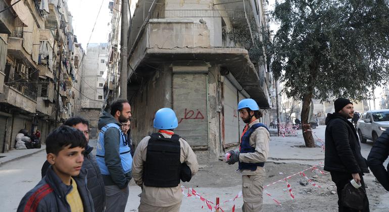 Samir Elhawary (left), UN disaster relief (UNDAC) team leader, speaks with residents of Aleppo, Syria.