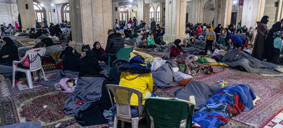 Families shelter at a mosque in the Al-Midan district of Aleppo, Syria, which has been turned into a collective shelter.