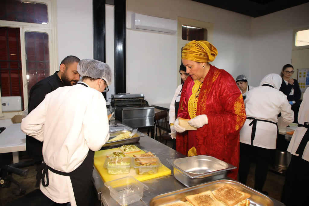 UN Deputy Secretary-General Amina Mohammad and Resident Coordinators from the Arab region visit the Access Kitchen project in Lebanon and engage with women with disabilities. The image shows the women with disabilities preparing food in a kitchen setting.