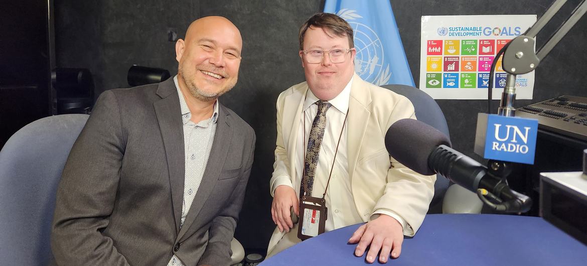 Nick Herd (right) and his colleague Warren Pot from L’Arche Canada are interviewed at the United Nations.