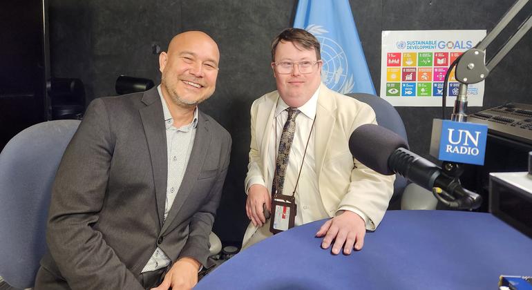Nick Herd (right) and his colleague Warren Pot from L’Arche Canada are interviewed at the United Nations.