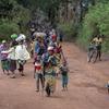 Displaced people walk back to Plain Savo site early morning after spending the night in host families in the nearby city of Bulé, in the Democratic Republic of Congo.