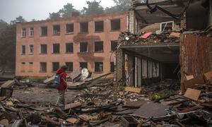 A girl walks through rubble in the courtyard of a school destroyed by bombing in Chernihiv, Ukraine. (file)