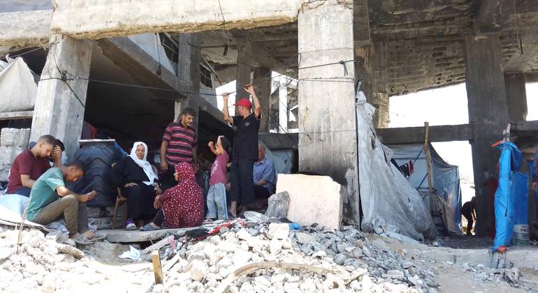 Displaced people in Gaza are living among the ruins of destroyed buildings.