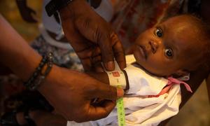 A young child is screened for malnutrition in Cité Soleil, Haiti.
