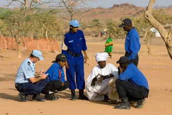 United Nations Police (UNPOL) interview Sudanese refugees in the Farchana camp in Chad.