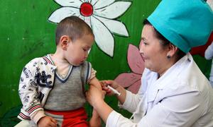 A young boy receives a measles immunization in Osh city in southwestern Kyrgyzstan.