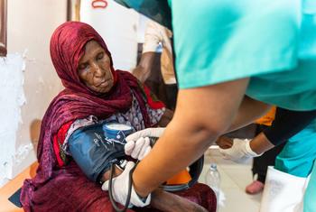 A woman receives medical care at a cholera treatment centre in Sudan.
