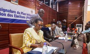 Prime Minister Felix Moloua of the Central African Republic, the President of the National Elections Authority, Me Mathias Morouba, and MINUSCA head Valentine Rugwabiza signed the Integrated Plan for Securing the Elections, on 14 February 2023.