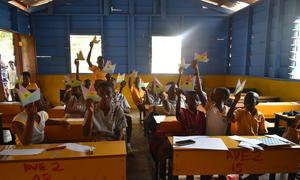 Pupils at Independence Avenue 1&2 Junior High School in Accra, Ghana, hold origami hummingbirds, as part of the World Water Day 2023 campaign. 