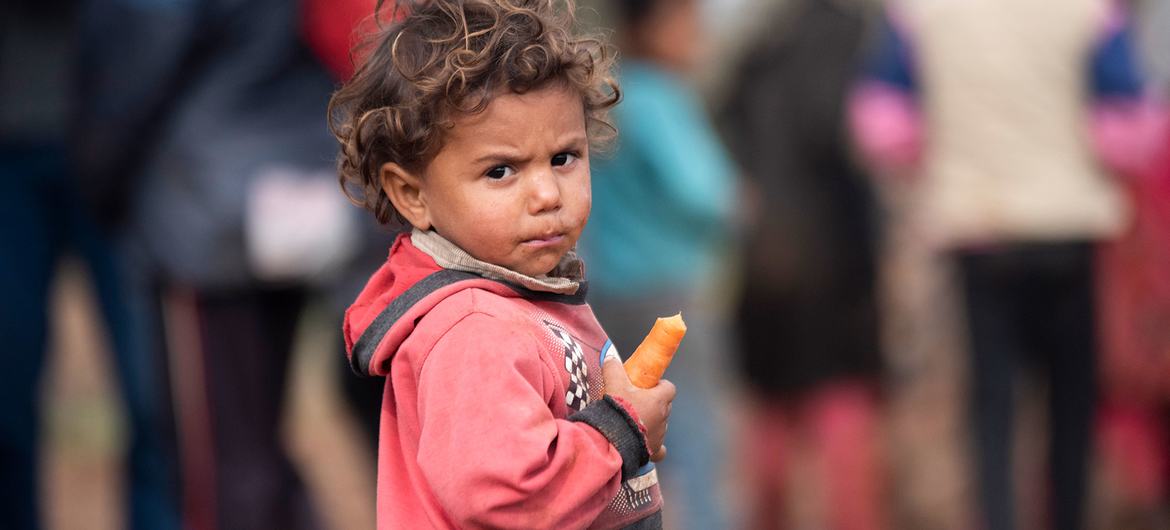 Families living in a displaced persons camp in southern Syria can barely provide food for their children. (file)