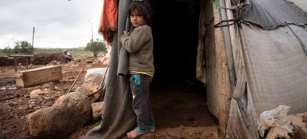 A seven-year-old girl who was expelled from the city lives in a labor camp with her family in southern Syria.  (file)