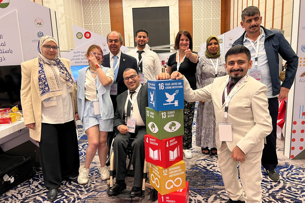 Group of people with disabilities participating in WEIF 2024 at UNIDO headquarters.