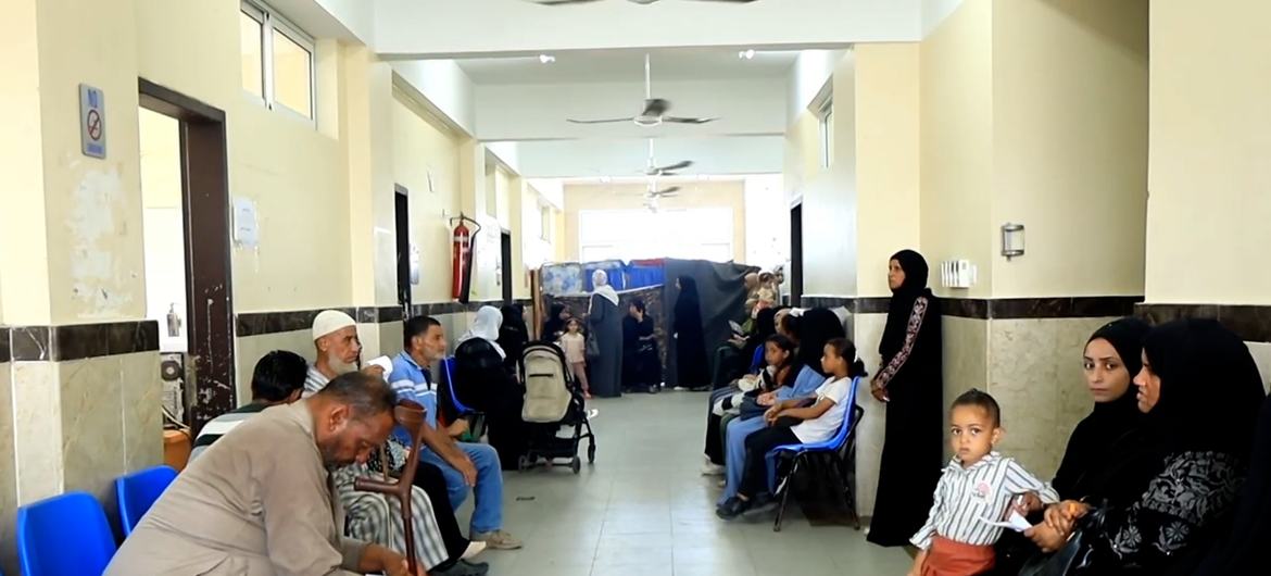 Patients wait inside an UNRWA clinic in Deir Al-Balah in central Gaza. 