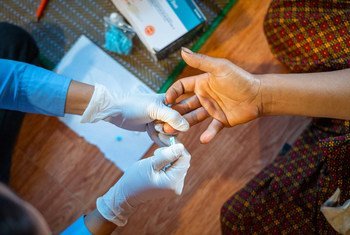 A dual HIV/syphilis rapid diagnostic test is used on a pregnant woman in Cambodia (file).