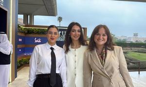 Three women posing for a photo at the UNAOC Riyadh Youth Forum, representing Georgia, Armenia, and Azerbaijan as part of the 2025 Young Peacebuilders programme.