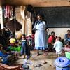 A health worker at a camp in southern Malawi talks to displaced people about cholera prevention measures. (file)