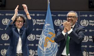 WHO Director-General Tedros Adhanom Ghebreyesus (right) and INB Co-Chair Anne-Claire Amprou of France (left) celebrate at the conclusion of negotiations in the early hours of 16 April 2025.