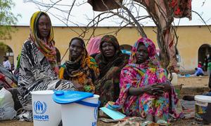 A family arrive at the UNHCR transit centre, near the Joda border point in Renk, South Sudan.