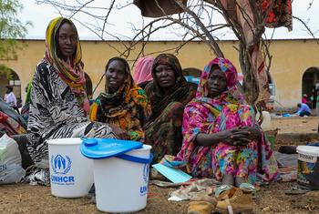 A family arrive at the UNHCR transit centre, near the Joda border point in Renk, South Sudan.