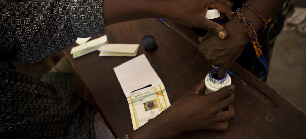 A woman casts her ballot during Mali’s 2013 presidential run-off election in Bamako. The recent dissolution of political parties by the military authorities has raised concerns about the future of democratic participation in the country. A woman casts her ballot during Mali’s 2013 presidential run-off election in Bamako. The recent dissolution of political parties by the military authorities has raised concerns about the future of democratic participation in the country.