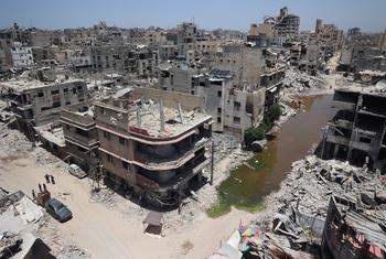 A view of central Khan Younis in Gaza, showing the aftermath of airstrikes in a residential neighborhood. A stream of sewage cuts through the area, the result of destroyed infrastructure, raising fears of disease outbreaks.