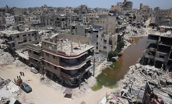 A view of central Khan Younis in Gaza, showing the aftermath of airstrikes in a residential neighborhood. A stream of sewage cuts through the area, the result of destroyed infrastructure, raising fears of disease outbreaks.