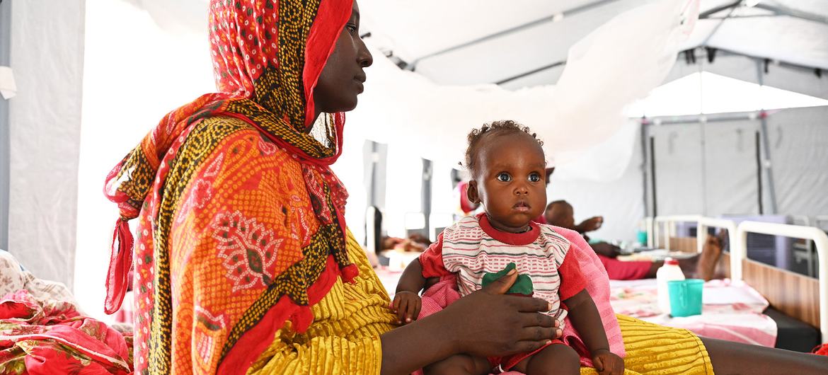 A Sudanese refugee receives care for her baby in the east of Chad