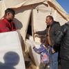 Aid provided by the International Organization for Migration (IOM) was distributed to displaced families in Azaz after crossing through Bab Al-Salam the previous day. 15 February 2023.