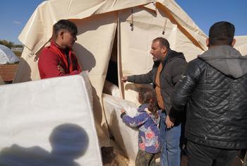 Aid provided by the International Organization for Migration (IOM) was distributed to displaced families in Azaz after crossing through Bab Al-Salam the previous day. 15 February 2023.