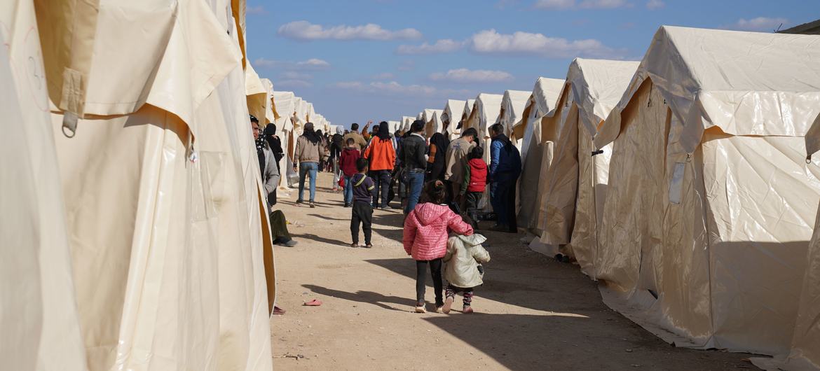 Families displaced by the earthquake are temporarily being accommodated in tents in Aziz, Syria. 