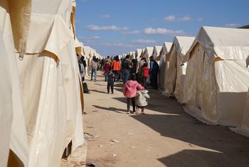 Families displaced by the earthquake are temporarily being accommodated in tents in Aziz, Syria. 