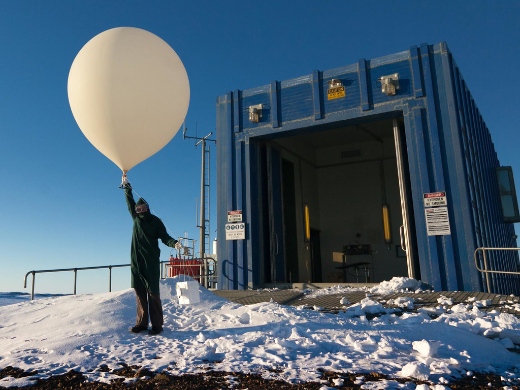 A weather ball is prepared for release at a station in the Australian Antarctic.