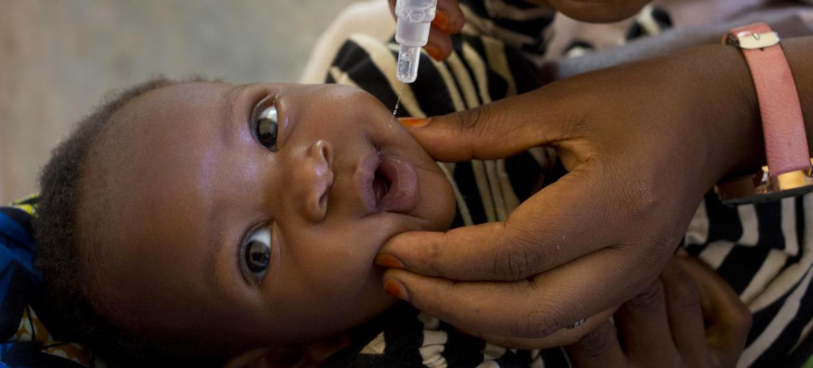 A child receives a polio vaccine in Burundi. (file)