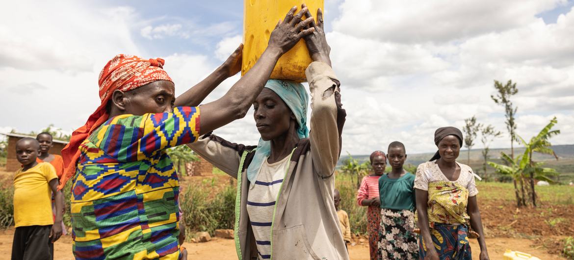 Women collect water in Nakivale refugee settlement in Uganda.