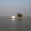In October 2022, a tent surrounded by flood water in Pakistan's Sindh province. More than 30 million people across the country were affected by the unprecedented floods triggered by intense monsoon rains.