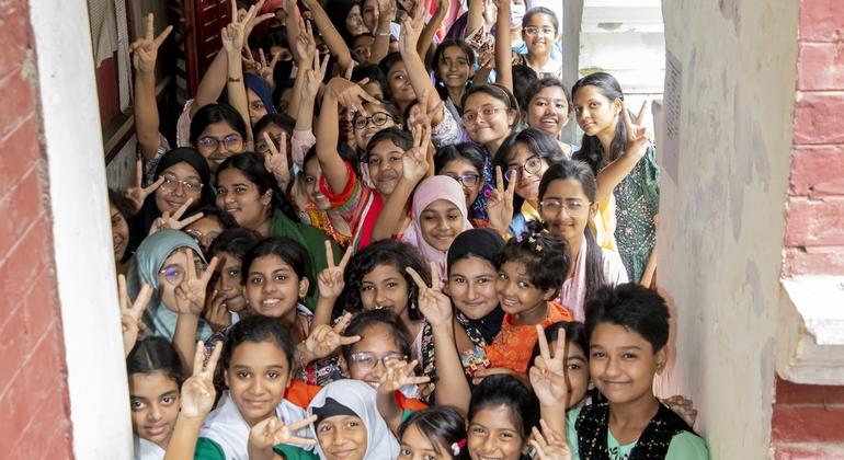Girls between the ages of 10 and 14 are standing in a queue to get the HPV vaccine at a girls' high school in Bangladesh.