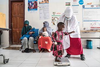 A child is weighed at a health clinic in Garowe, Somalia.