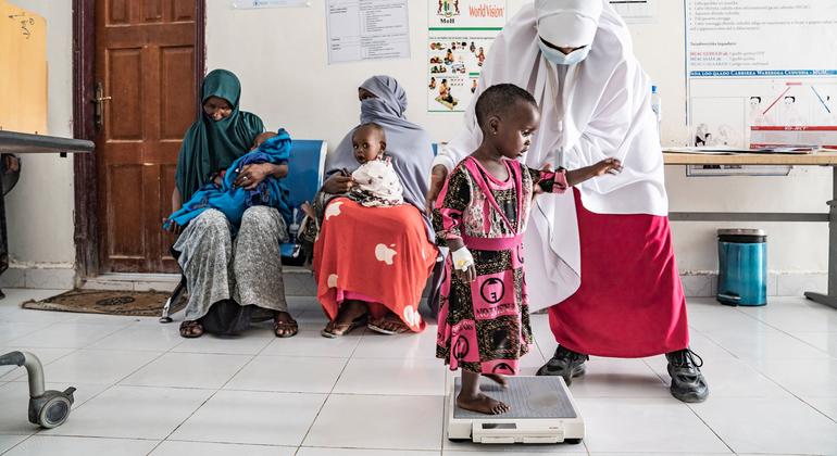 A child is weighed at a health clinic in Garowe, Somalia.