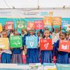 Students in Tanzania hold Sustainable Development Goals (SDG) cards.