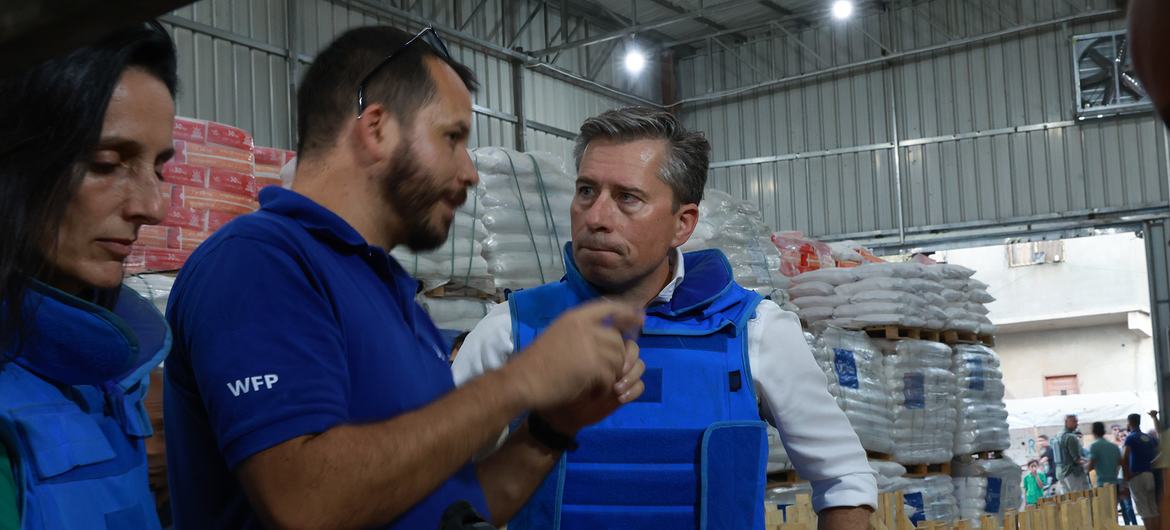 Tom Fletcher talks to a UN humanitarian worker shortly after entering Gaza on Friday.