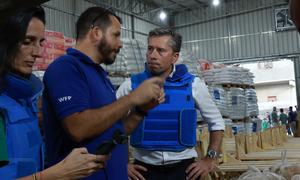 Tom Fletcher talks to a UN humanitarian worker shortly after entering Gaza on Friday.