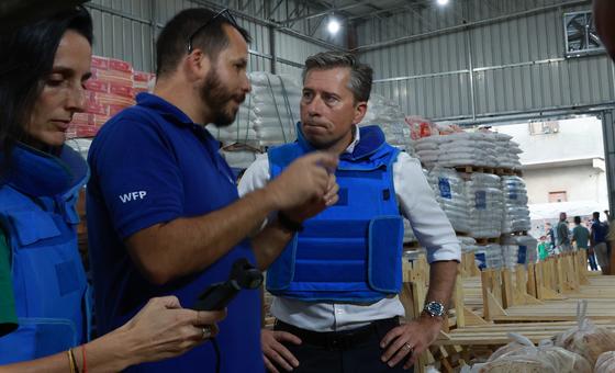 Tom Fletcher talks to a UN humanitarian worker shortly after entering Gaza on Friday.