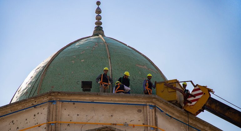 Workers are repairing the al-Nuri mosque in Iraq's Mosul. This part was destroyed in an explosion in 2017.