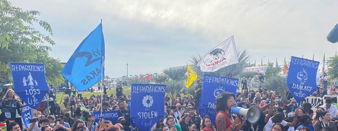 People protest for reparations for stolen land at COP27 in Sharm El-Sheikh in Egypt.