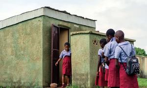 Children use toilet facilities at a school in Nigeria.